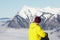 Teenage Snowboarder Admiring Mountain View