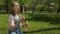 A teenage with soap bubbles in the park.