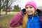 Teenage sporty girl listening to music outdoor.