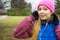 Teenage sporty girl listening to music outdoor.