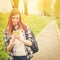 Teenage student girl with smart phone texting