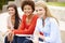 Teenage student girls working outdoors