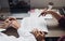 Teenage student works on homework in his room and writing in notebook