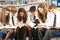 Teenage Students In Library Reading Books