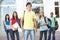 Teenage Students Standing Outside College Building