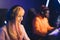 Teenage white girl wearing headset smiling competing in online game tournament with her friend. Blurred background. Blue