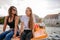 Teenage women sitting on pedal boat