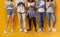 Teenaged mixed race group of friends using smartphones, cropped