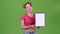 Teenager advertises a tablet for paper. Green screen