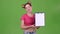 Teenager advertises a tablet for paper. Green screen. Slow motion