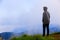 Teenager asian boy standing at mountain