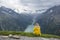 Teenager blonde girl Hiking in Alps, Lake Schlegeis, Zillertal Alps, Austria