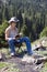 Teenager with book in mountain hike