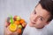 Teenager boy with all the right diet choices - holding fruit plate and fresh juice