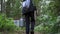 Teenager boy carrying an aluminium milk can with blueberries