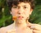 Teenager boy with disgust grimace hold unusial strange thai food