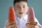 Teenager boy happy portrait with juicy frozen home made ice cream