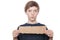 Teenager boy holding a brown piece of cardboard in