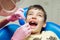 Teenager boy patient at the dentist. A boy with problem teeth sitting in a dental chair.