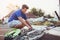 Teenager boy repair tire on bicycle