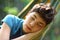 Teenager boy resting in hammock