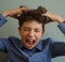 Teenager boy scratching head itch because of lice