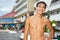 Teenager boy standing near hotel on resort
