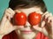 Teenager boy with tomato eyes close up portrait