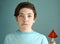 Teenager boy with water melon shape sugar candy on stick