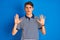 Teenager boy wearing casual t-shirt standing over blue isolated background Moving away hands palms showing refusal and denial with