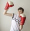 Teenager boy in a white shirt without sleeves and in boxing gloves