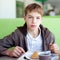 Teenager in cafe eating fast food