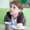 Teenager in cafe eating fast food