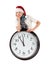 Teenager in cap of Santa Claus and large clock