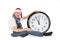 Teenager in cap of Santa Claus and large clock