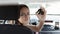 Teenager in car, buying a car, a happy woman driving with car keys
