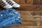 Teenager casual outfit. Boys shoes, clothing and accessories on wooden background - jeans, sneakers. Top view. Flat lay