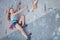 Teenager climbing a rock wall