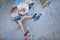 Teenager climbing a rock wall