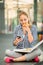 Teenager eating pizza looking in phone