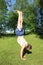 Teenager exercising handstand