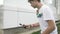 Teenager exercising talent by catching kendama ball on spike slow motion -
