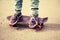 Teenager feet in jeans and gumshoes on skateboard