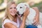 Teenager with fourteen years old labrador dog in the park