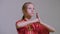 Teenager girl do kung fu greeting two hands together with right fist on the left palm is the Wushu Tai Chi Chinese