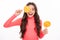 Teenager girl eating sugar lollypop. Candy and sweets for kids. Child eat lollipop popsicle over white isolated