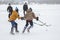 Teenager girl fighting with teenager boy while playing hockey on a frozen river Dnipro in Ukraine