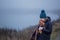 Teenager  girl hugging  teddy bear by foggy  lake.  Concept of adolescence and adolescent problems