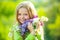 Teenager girl with lilac. Spring girl in blooming garden. Outdoor portraits of beautiful smiling teenager girl.