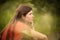 Teenager girl with long thick brown hair outdoor portrait